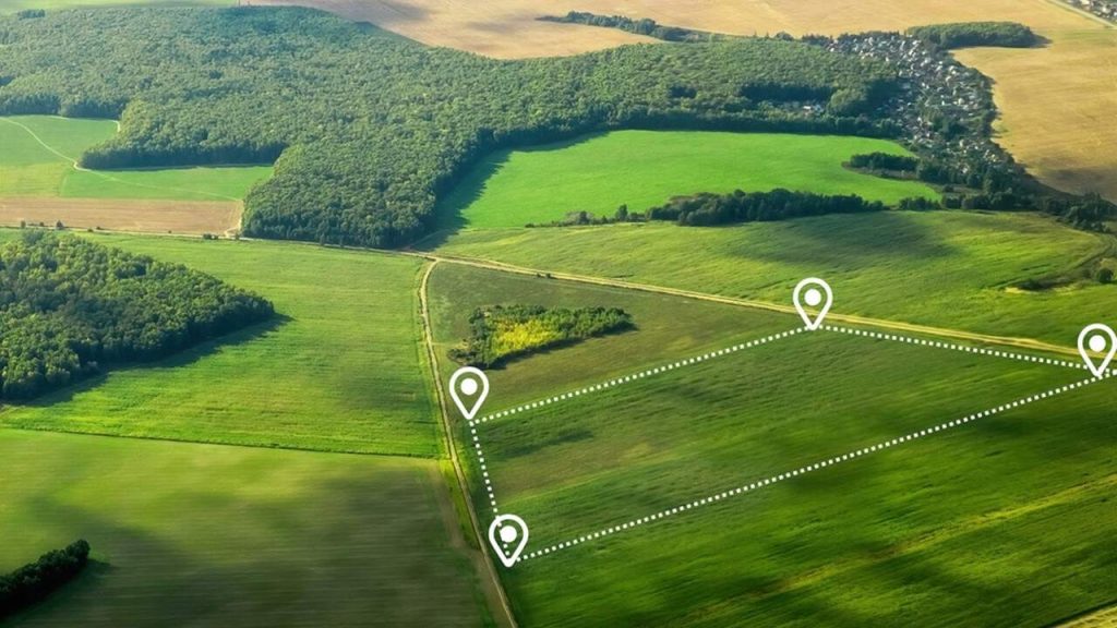 Aerial view of a green field land development area